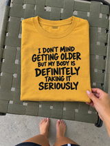 I Don't Mind Getting Older But My Body Takes It Seriously T-Shirt