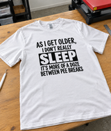 Getting Older Means Dozing Between Pee Breaks T-Shirt